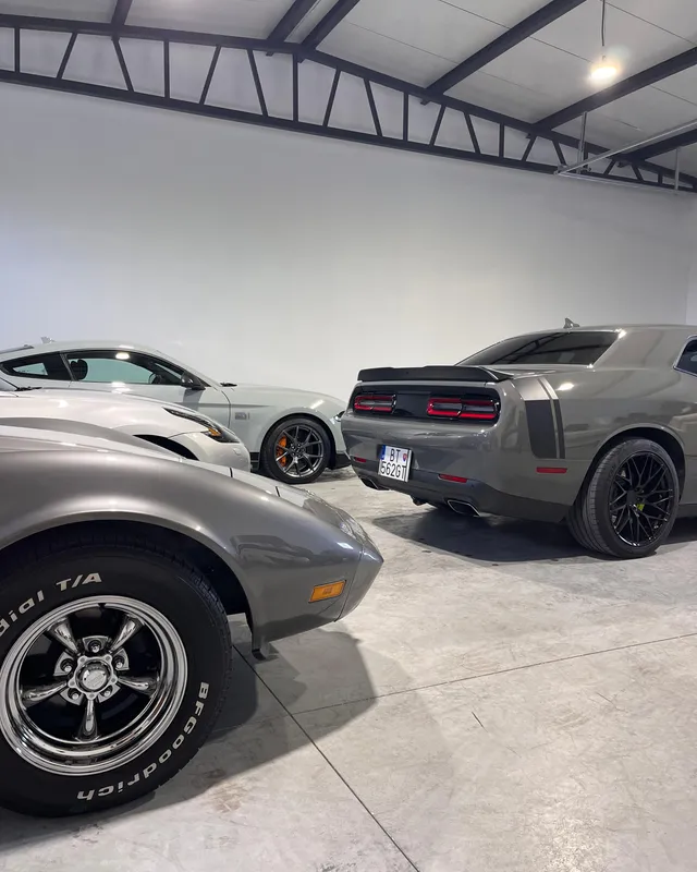 Cars in the Kingsman Garage showroom