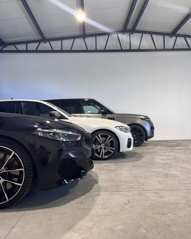 Lineup of cars at Kingsman Garage